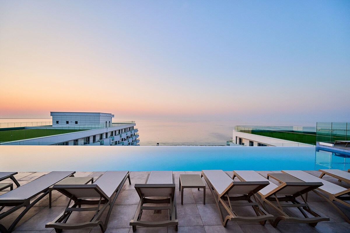 La Playa Apartment in Infinity Beach Resort - parking — Apartment — sea-view vacation rental at Infinity Resort & SPA, Mamaia Nord, Constanța, Romania — main property photo | Aqua Vista Rentals